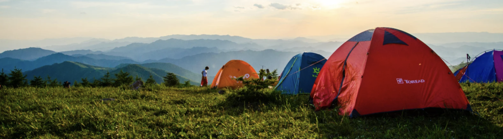 Tents Overlooking Mountain Ranges
