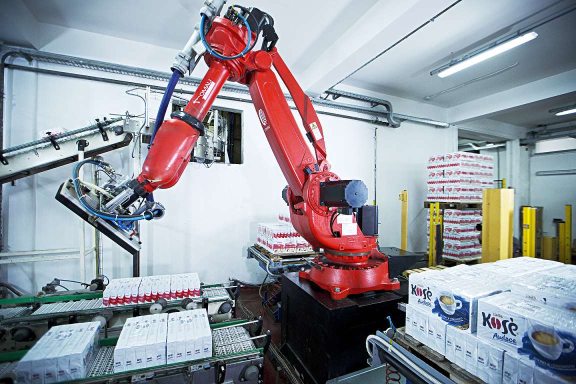 A red robot in a factory.