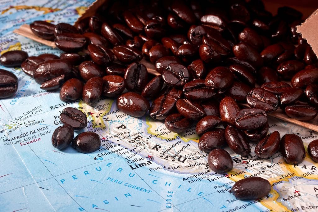 Coffee beans on top of a map.