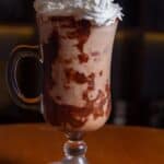 chocolate drink with whipped cream in a glass