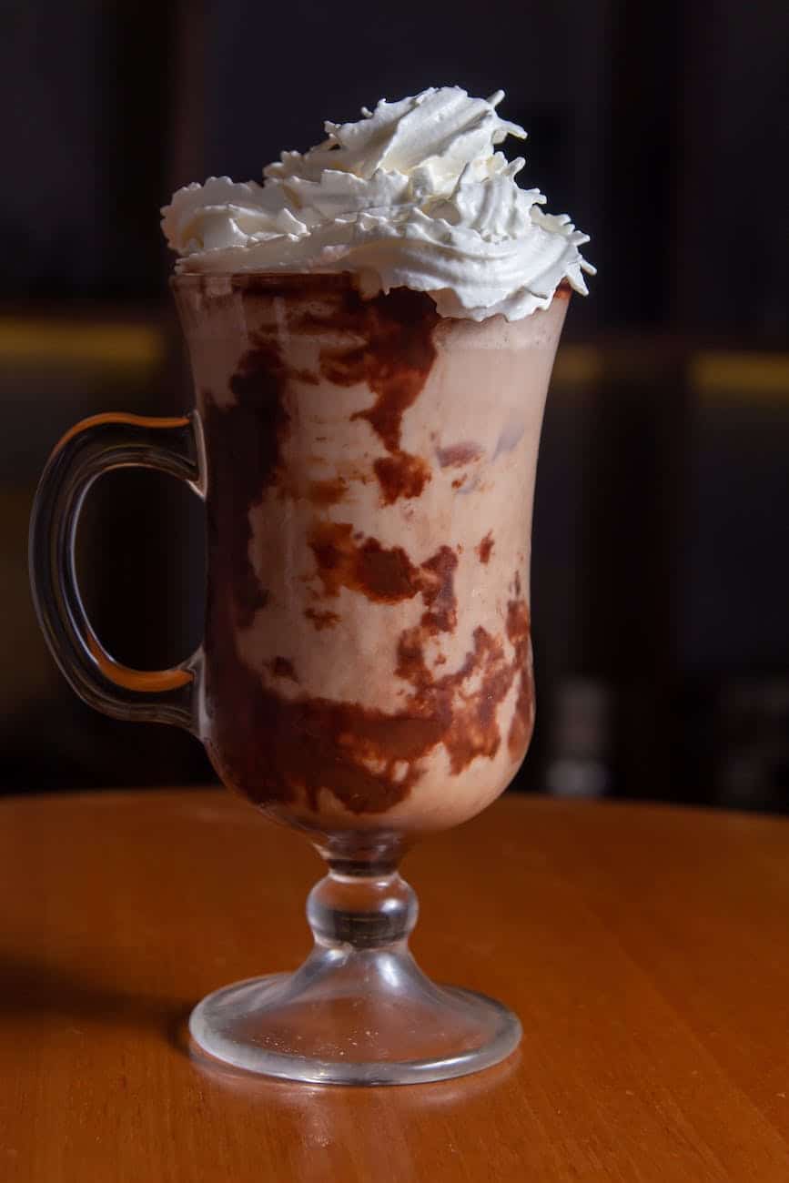 chocolate drink with whipped cream in a glass
