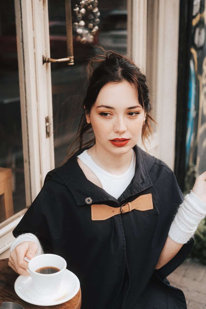 woman posing with coffee cup