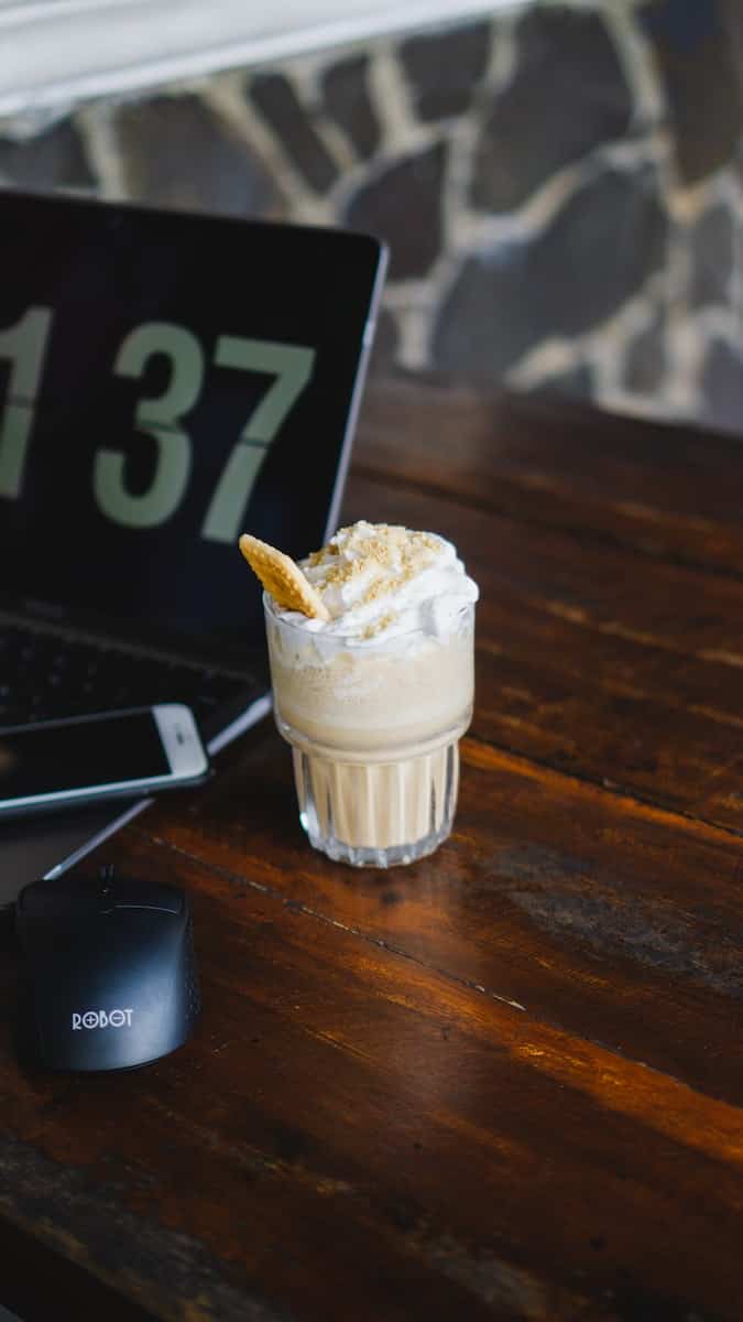A Glass of Frappe on Wooden Table Top