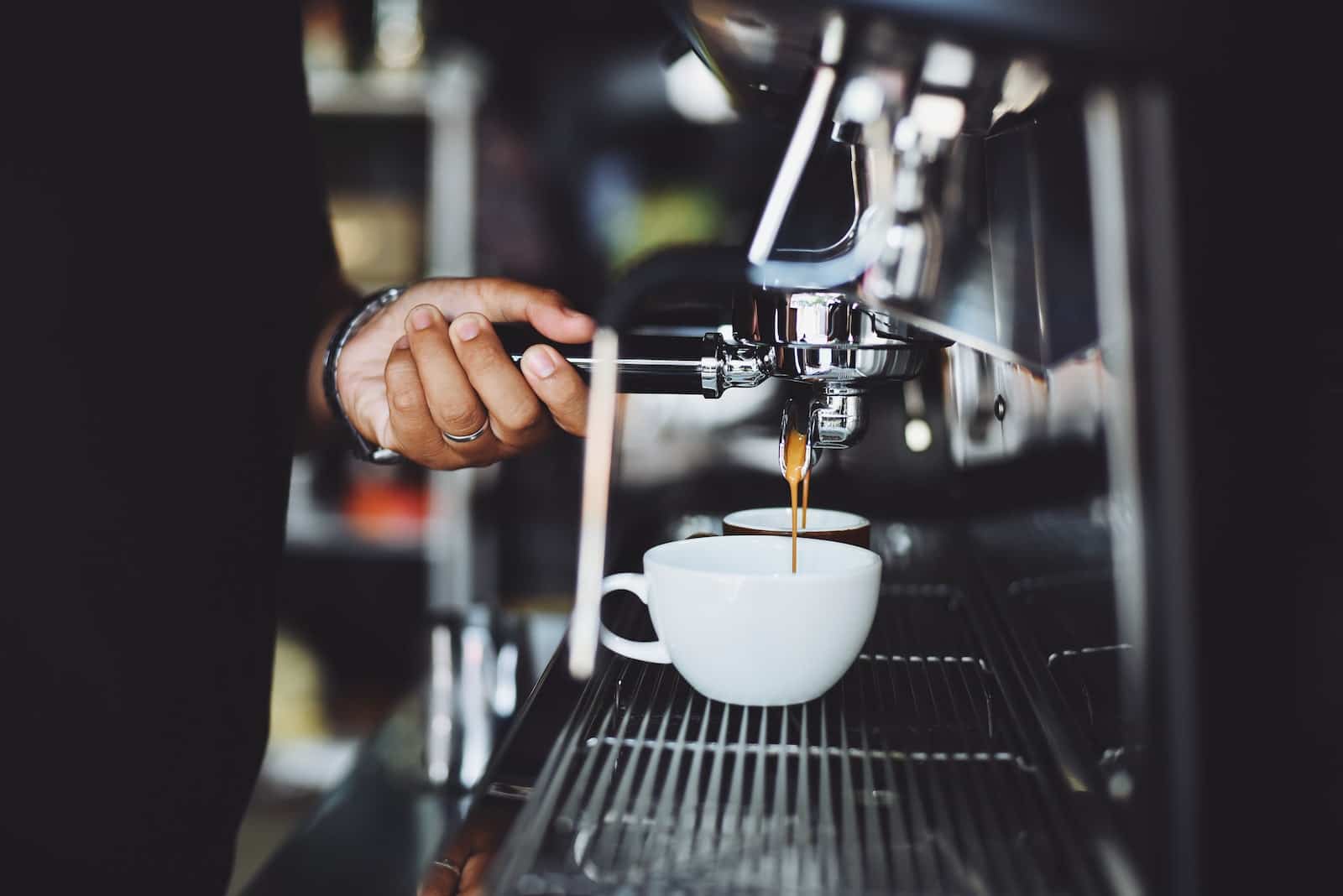 Close-up of Hand Holding Coffee Machine
