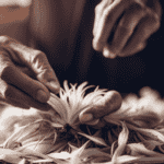 An image showcasing the step-by-step process of extracting fibers from chicory root: a close-up of hands gently peeling the root, followed by a detailed shot of the fibers being carefully separated, ending with a pile of pristine chicory fibers
