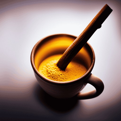 An image showcasing a steaming cup of turmeric latte, with a rich golden hue and a hint of cinnamon sprinkled on top