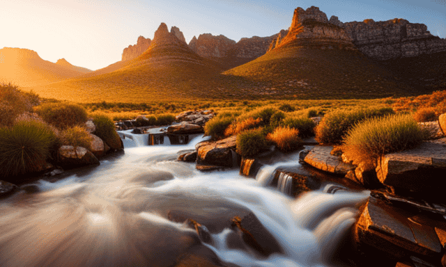An image showcasing the picturesque Cederberg Mountains, bathed in warm sunlight