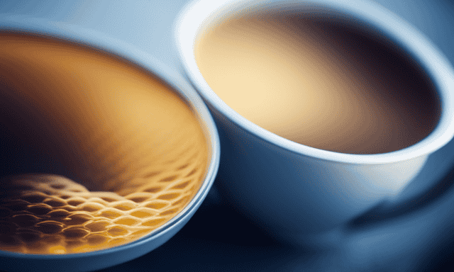 An image featuring a milky golden tea swirling in a glass teacup, adorned with delicate honeycomb patterns