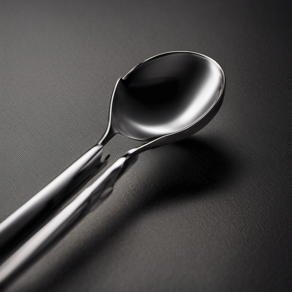 An image of a measuring spoon filled with 2 1/4 teaspoons of a substance being poured into a tablespoon