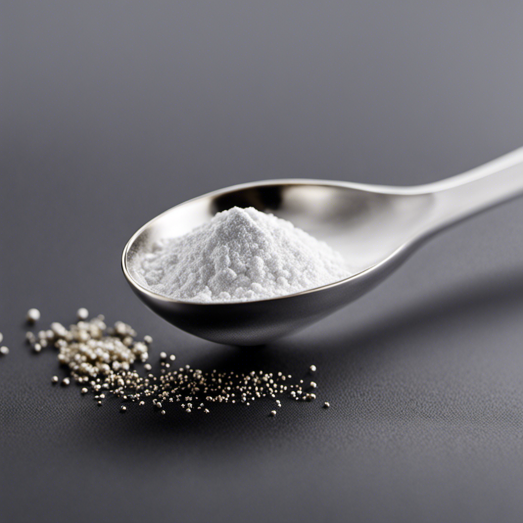 An image showing a delicate silver teaspoon, filled with a fine white powder that barely covers the tip