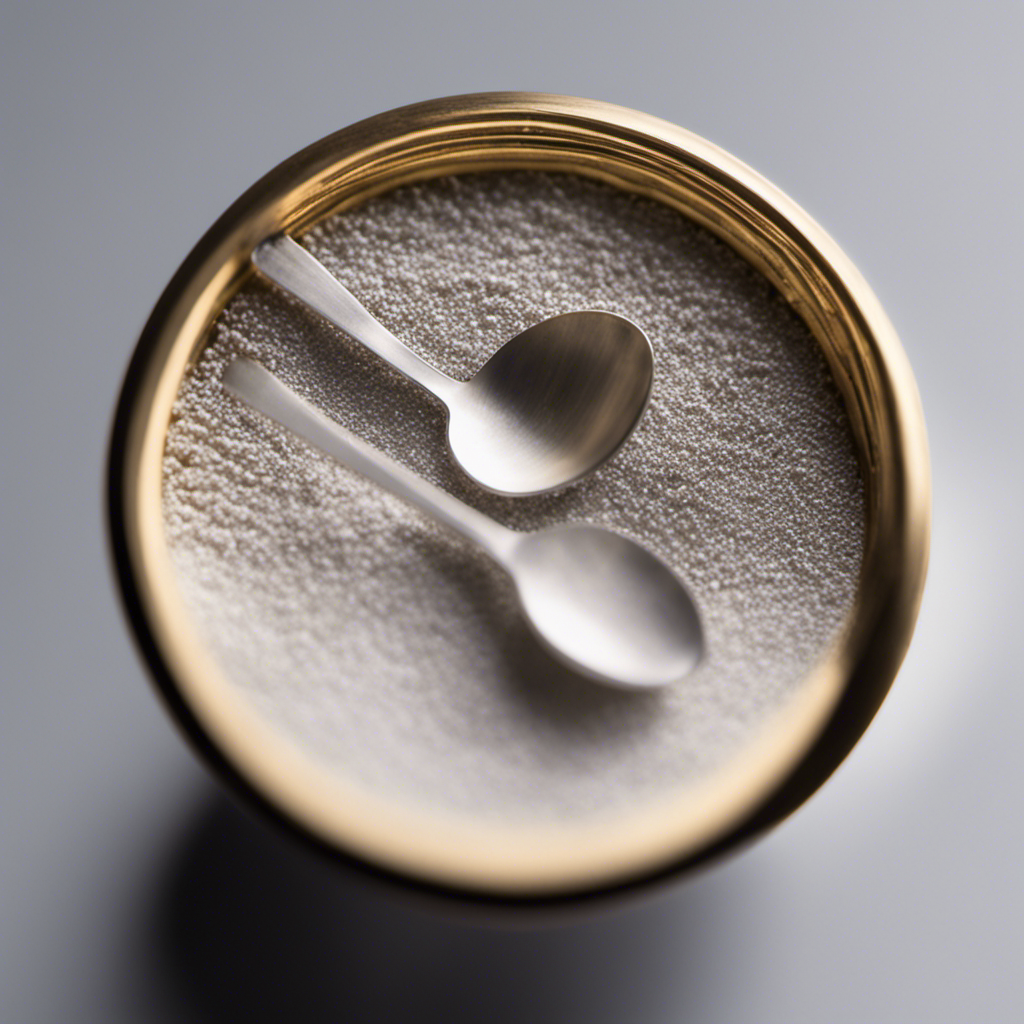 An image displaying a small, delicate teaspoon filled with two minuscule grains of a powdered substance, representing 2 mg