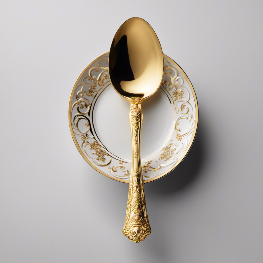 An image capturing a delicate silver teaspoon, its bowl filled with precisely measured, shimmering golden accents