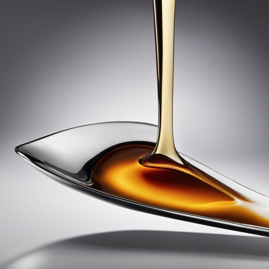 An image of a measuring spoon filled with a single shot of liquid, precisely poured into a teaspoon