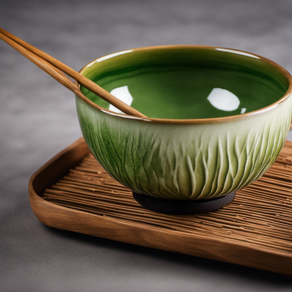 An image capturing the elegance of a handcrafted matcha bowl: an intricate pattern of delicate brushstrokes in vibrant shades of green, complemented by a smooth, polished surface, inviting the viewer to appreciate the fusion of beauty, functionality, and tradition