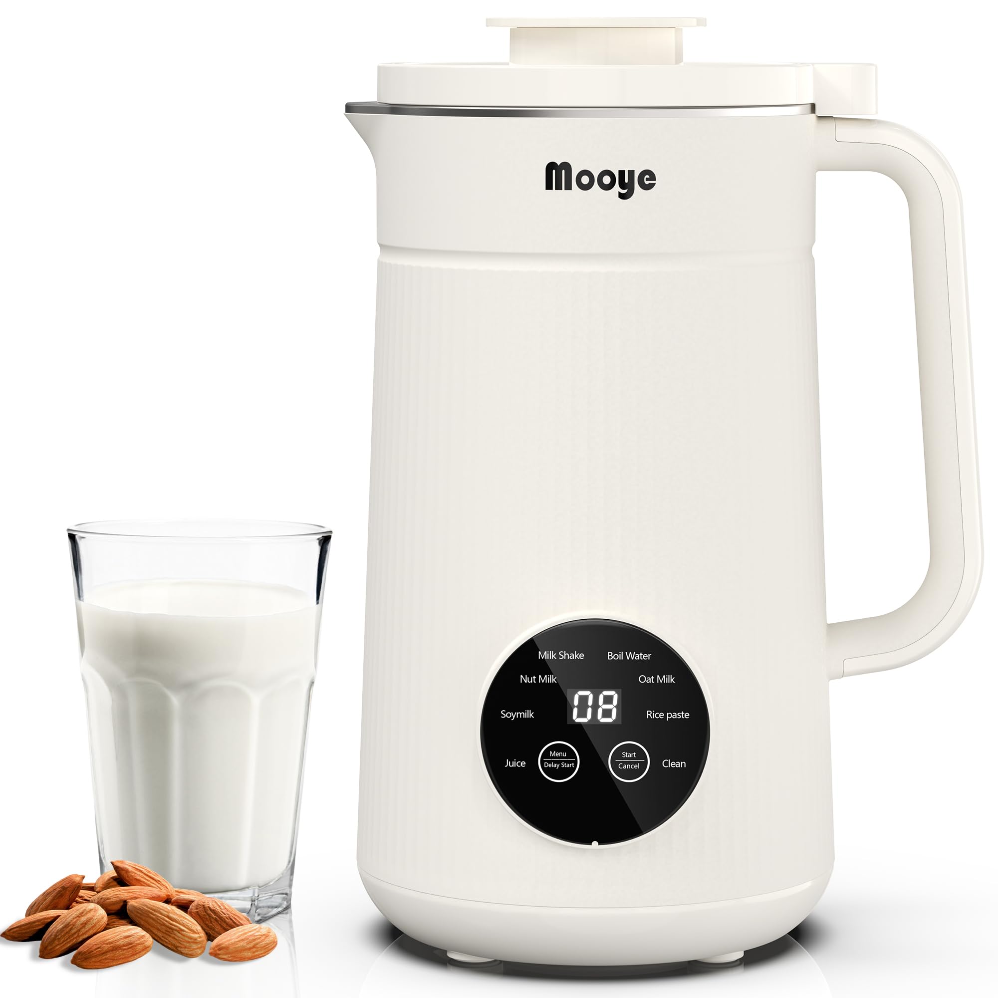 A blender with almonds and a glass of milk.
