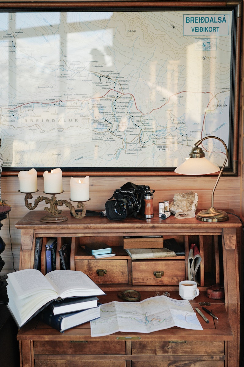 Vintage interior with old fashioned wooden desk and big map