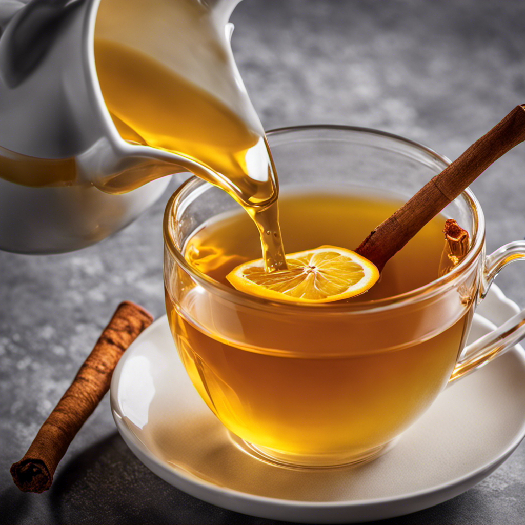 An image of a vibrant yellow turmeric tea being poured from a ceramic teapot into a delicate transparent teacup