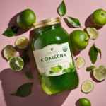 An image showcasing a glass jar filled with vibrant green kombucha, infused with delicate tendrils of green tea leaves gracefully swirling within, capturing the essence of the perfect ratio for Jun kombucha